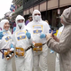 Revelers make fun of the coronavirus pandemic during Mardi Gras in New Orleans, Louisiana on February 25, 2020.